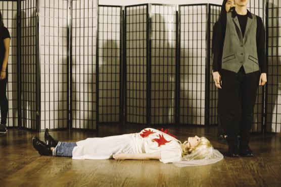 woman dressed as a bride lying on the floor